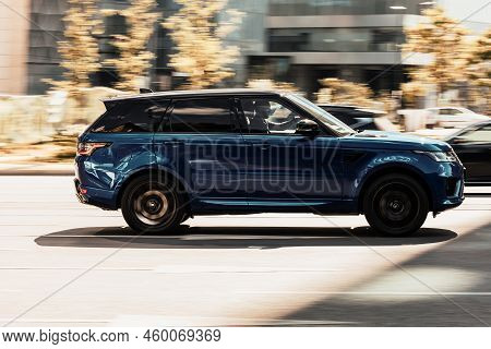 Range Rover Sport L494 At The Test Drive On City Highway. Blue Suv Car In Motion, Side View. Moscow,