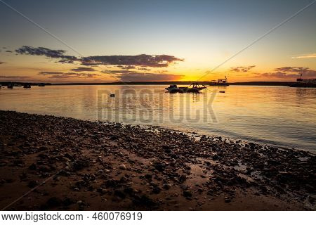 Fisherman Boat During Sunset. Tropical Vacation Landscape.
