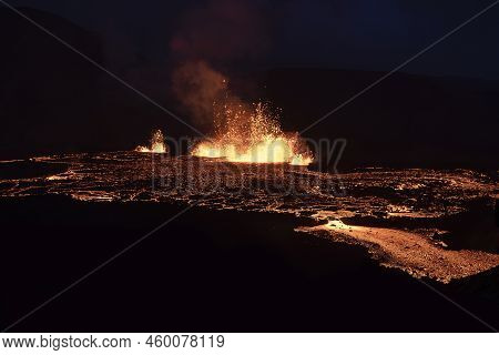 Volcano Eruption At Meradalir Near Fagradalsfjall, Iceland. Erupting Magma And Flowing Lava At Night