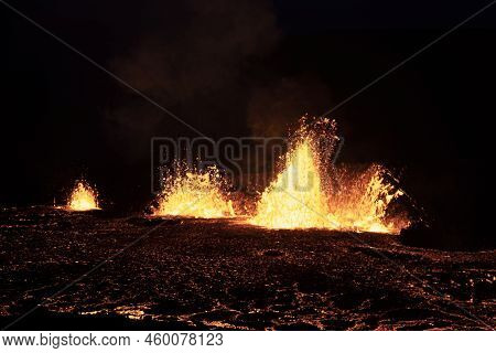 Volcano Eruption At Meradalir Near Fagradalsfjall, Iceland. Erupting Magma And Flowing Lava At Night