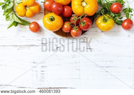 Raw Organic Vegetables. The Concept Of Vegan Or Diet Food. Fresh Ripe Bunch Colorful Tomatoes, Red,