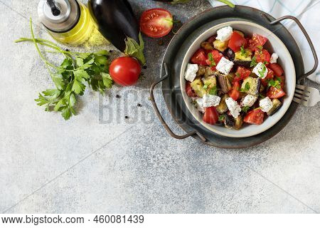 Healthy Vegetarian Diet Food. Salad With Grill Eggplants, Tomatoes And Feta Cheese On A Gray Stone T