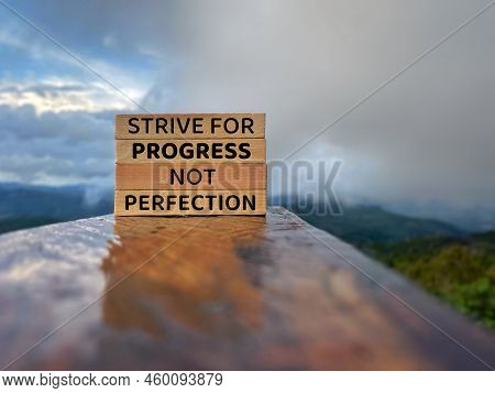 Strive For Progress, Not Perfection Text On Wooden Blocks With Nature Background. Stock Photo.