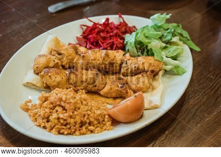 Chicken Grilled Served With Rice And Pita Bread