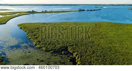 Summertime View Of The Shore Along The Fox River Near Oshkosh In Wisconsin