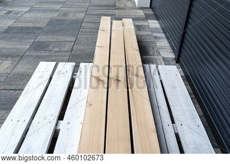 Raw Planed Pine Wooden Beams, Dimensions 100x100mm, Lying Next To Each Other.