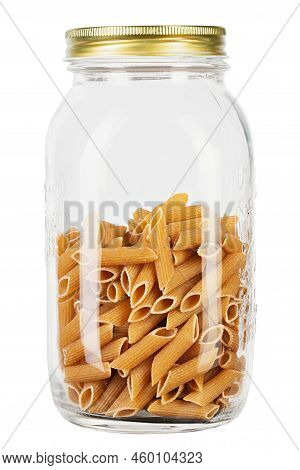 Whole Grain Penne Pasta From Durum Wheat In Jar Isolated On White Background. Healthy Eating Concept