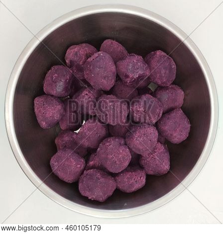 Top View Group Of Ball Shape Organic Purple Taro Rooth In Metalic Bowl Isolated On White Backgrounds