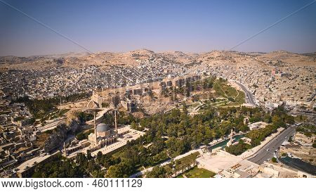 Aerial View Of Sanliurfa Castle, Rooftops, Park Around Balikligol And Mevlidi Halil Mosque. Historic