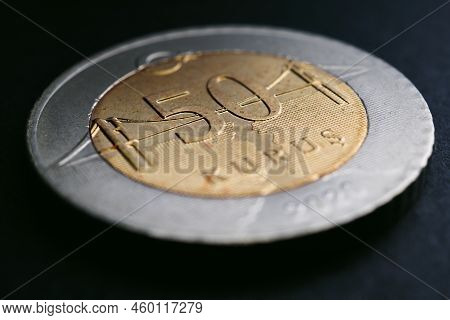 Translation: 50 Kurus. Turkish Coin Of 50 Kuruş Lies On A Black Surface Close Up. National Currency 