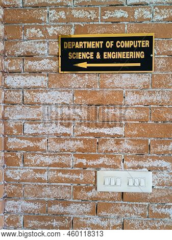 Sign Board Of Department Of Computer Science And Engineering On Red Brick Wall
