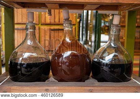 Big Bottles With White And Red Wine Austrian Vinegar Made From Local Grapes On Market In Vienna, Aus