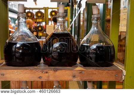Big Bottles With White And Red Wine Austrian Vinegar Made From Local Grapes On Market In Vienna, Aus
