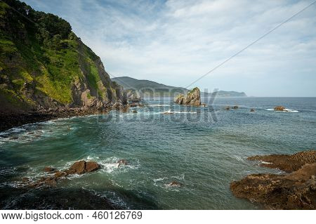 Stone Footpath To Famous Landmark And Film Location In North Of Spain, Ocean Islet With Chapel San J