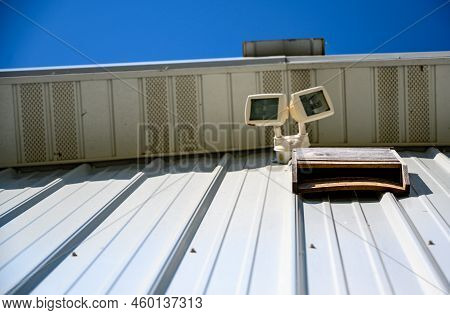 Wooden Bat House On White Corrugated Tin Barn