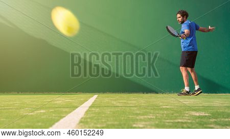 Professional Monitor Of Padel Jump To The Ball With A Black Racket. Sport Game