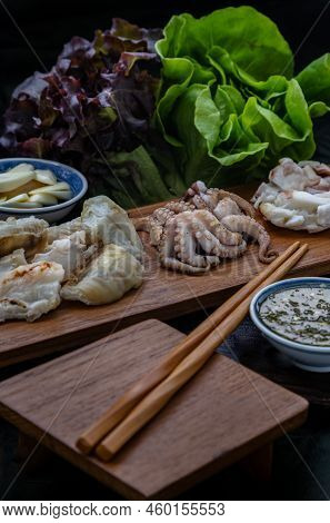Fresh Grilled Squid, Octopus Tentacles And Squids Eggs On Wooden Tray Served With Fresh Vegetables, 