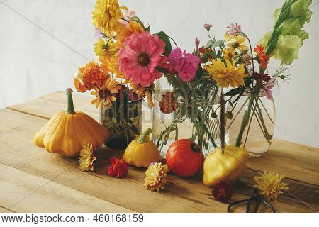 Autumn Moody Still Life, Atmospheric Image. Colorful Autumn Flowers, Pumpkins, Pattypan Squashes Com