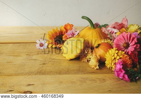 Stylish Autumn Composition On Rustic Background. Colorful Autumn Flowers, Pumpkins, Pattypan Squashe