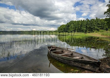 Old Wooden Boat On The Forest Lake In Aluksne. Aluksne Lake Is A Eleventh Largest Lake In Latvia And