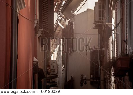 Selective Blur On The Wooden Shutters Of Houses In Typical Mediterranean Old Narrow Street With Sout