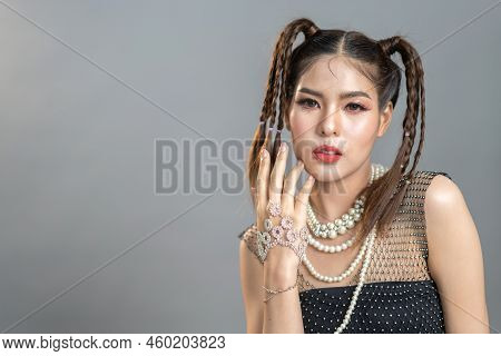 Portrait Of Smiling Cheerful Beautiful Pretty Asian Fashion Woman Posing Smile In Black Fashion Clot