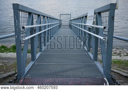 Bridge Leading To A Gate On The River Dock