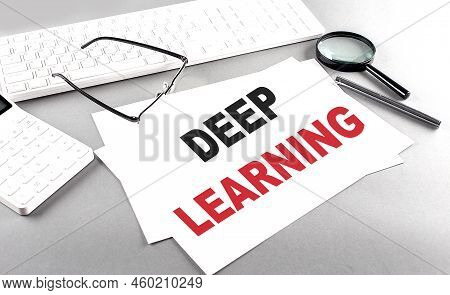Deep Learning Text On Paper With Keyboard, Calculator On Grey Background