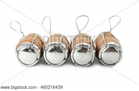 Sparkling Wine Corks With Muselet Caps On White Background