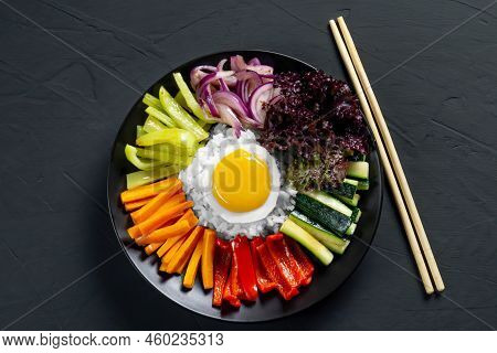 Close-up Of A Korean Dish, With A Variety Of Appetizers With Vegetables And Eggs. Diet. Bibimbap. To