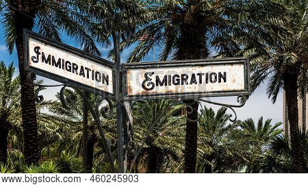 Street Sign The Direction Way To Emigration Versus Immigration