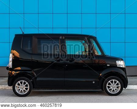 Novosibirsk, Russia -   August 03, 2022:   Black Honda N-box,  Is Parked  On The Street On A Warm Su