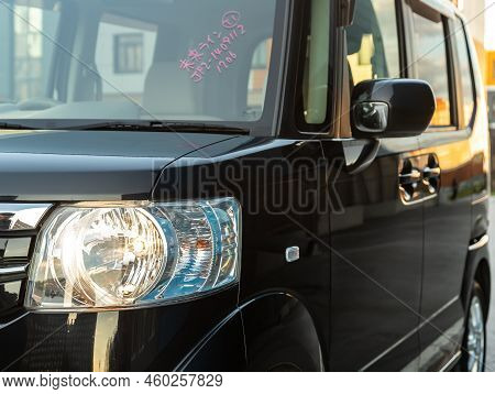 Novosibirsk, Russia -   August 03, 2022:   Honda N-box,   Close Up Of The Car Headlights. Exterior C