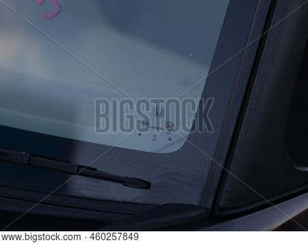 Novosibirsk, Russia -   August 03, 2022:   Honda N-box,  Closeup Of Honda Badge On Original Windshie