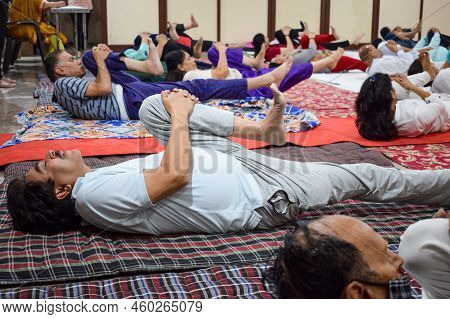 New Delhi, India, June 19 2022 -group Yoga Exercise Session For People Of Different Age Groups In Ba