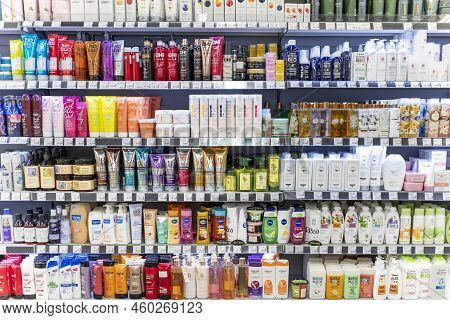 Latvia, Riga, August, 2022: Shelves With Shampoos And Conditioners With Reduced Prices On Sale In Ri