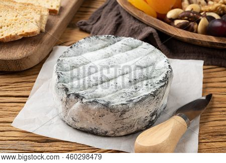 Brazilian Artisan Lua Cheia Cheese With Toasts, Fruits And Nuts Over Wooden Table.
