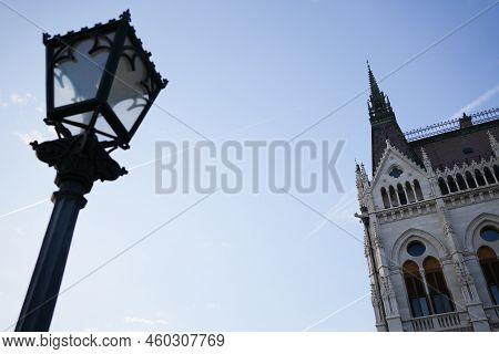 Decorated Street Lamp And Tower Of Parliament Budapest