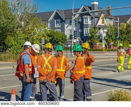 Road Worker Construction. Road Workers Inspecting Construction. Engineer Worker Tablet Working On Si