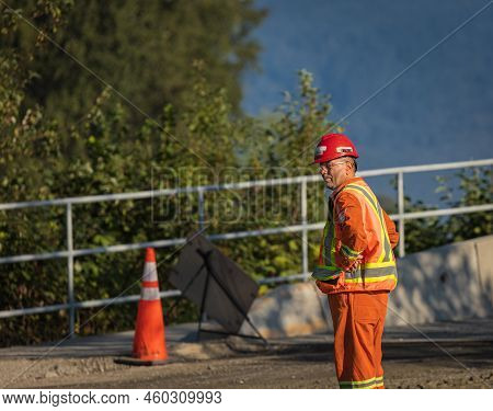 Road Worker Construction. Road Workers Inspecting Construction. Engineer Worker Tablet Working On Si