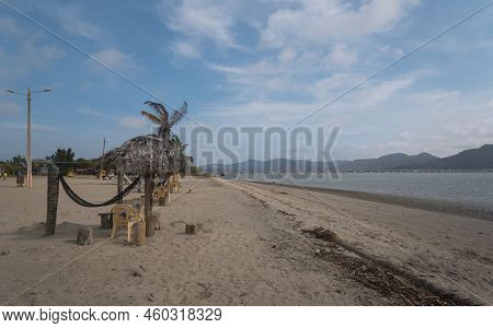 San Vicente, Manabi / Ecuador - August 20 2022: People Walking Along The Beach Of The Town With The 