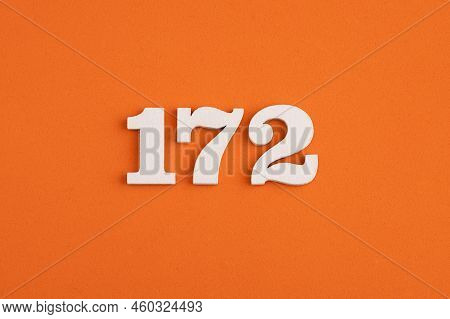 White Wooden Number 172 On Eva Rubber Orange Background