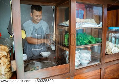 The Seller Prepares To Cook The Chicken Noodle Dish
