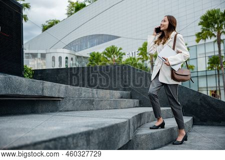 Stepping Going Up Stairs In City, Business Woman Hold Laptop Computer Talking Mobile Phone She Hurry