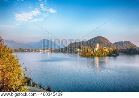 Gorgeous Sunny Day View Of Popular Tourist Destination  Bled Lake. Dramatic View Of Pilgrimage Churc