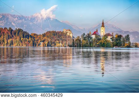 Astonishing Sunset View Of Popular Tourist Destination  Bled Lake. Dramatic View Of Pilgrimage Churc