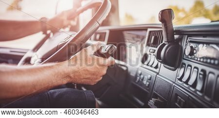 Driver Of Semi-truck Sitting And Drining His Vehicle