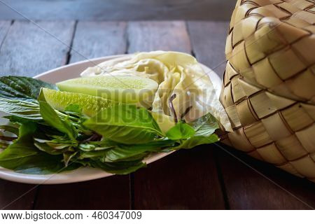 Bamboo Wicker Sticky Rice Basket And Vegetable Side Dish.