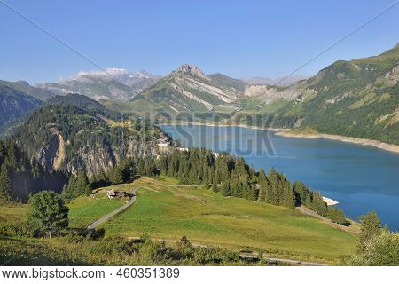 Beautiful Landscape With A Lake And Peak Montain Back And Green Meadow In The Foreground In French A