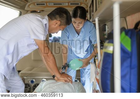 Group Of Rescue Emergency Team Transporting Patient From Emergency Car  Through Hospital Corridors.